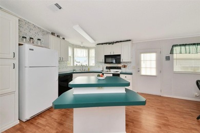 Pristine and move-in ready in Golf Lakes, a gated 55+ on Heather Hills Golf Course in Florida - for sale on GolfHomes.com, golf home, golf lot