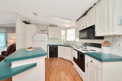 Pristine and move-in ready in Golf Lakes, a gated 55+ on Heather Hills Golf Course in Florida - for sale on GolfHomes.com, golf home, golf lot