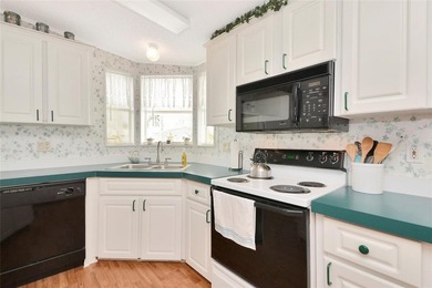 Pristine and move-in ready in Golf Lakes, a gated 55+ on Heather Hills Golf Course in Florida - for sale on GolfHomes.com, golf home, golf lot