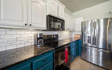 This charming 4-bedroom, 2-bath home in Patricia Island Country on Patricia Island Golf Club in Oklahoma - for sale on GolfHomes.com, golf home, golf lot