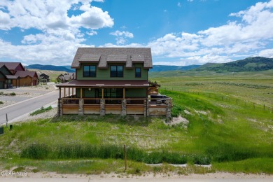 This stunning home, completed in 2022, has outstanding views on Grand Elk Ranch and Club in Colorado - for sale on GolfHomes.com, golf home, golf lot