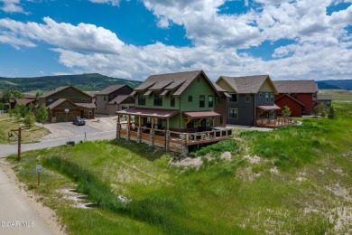 This stunning home, completed in 2022, has outstanding views on Grand Elk Ranch and Club in Colorado - for sale on GolfHomes.com, golf home, golf lot
