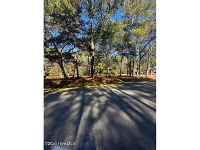 Secure this rare two-lot package in the gated Lockwood Folly on Lockwood Folly Country Club in North Carolina - for sale on GolfHomes.com, golf home, golf lot