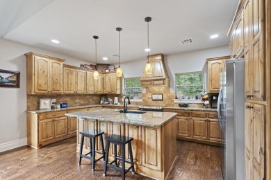 Situated on an oversized corner lot in the gated community of on The Coves Golf Course in Oklahoma - for sale on GolfHomes.com, golf home, golf lot