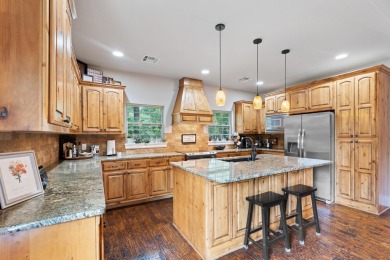 Situated on an oversized corner lot in the gated community of on The Coves Golf Course in Oklahoma - for sale on GolfHomes.com, golf home, golf lot