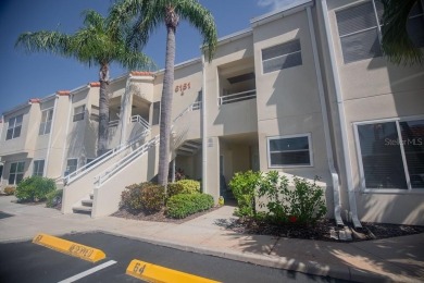 Location, lifestyle, and leisure await! Nestled in a beautifully on Isla Del Sol Yacht and Country Club in Florida - for sale on GolfHomes.com, golf home, golf lot