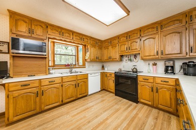 Welcome to your dream home nestled on a quiet, tree-lined on Indian Hills Country Club in Arkansas - for sale on GolfHomes.com, golf home, golf lot