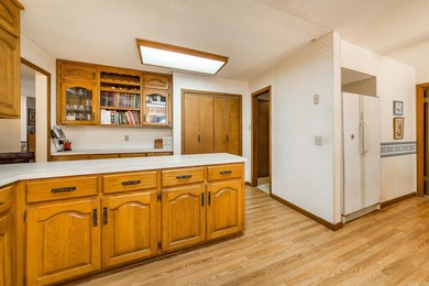 Welcome to your dream home nestled on a quiet, tree-lined on Indian Hills Country Club in Arkansas - for sale on GolfHomes.com, golf home, golf lot