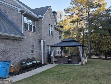 Welcome to this beautifully maintained all-brick home, ideally on Canongate At Georgia National Golf Club in Georgia - for sale on GolfHomes.com, golf home, golf lot