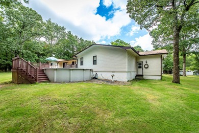 Welcome to your dream home nestled on a quiet, tree-lined on Indian Hills Country Club in Arkansas - for sale on GolfHomes.com, golf home, golf lot