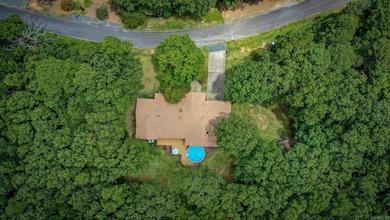 Welcome to your dream home nestled on a quiet, tree-lined on Indian Hills Country Club in Arkansas - for sale on GolfHomes.com, golf home, golf lot