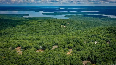 Welcome to your dream home nestled on a quiet, tree-lined on Indian Hills Country Club in Arkansas - for sale on GolfHomes.com, golf home, golf lot