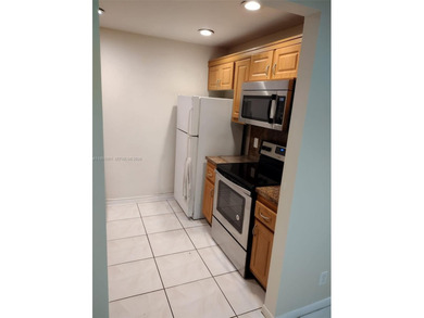 REMODELED, SPACIOUS, 1BR 1.5 BA, CONVENIENTLY LOCATED ON 1ST on Flamingo Lakes Country Club in Florida - for sale on GolfHomes.com, golf home, golf lot