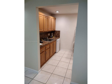 REMODELED, SPACIOUS, 1BR 1.5 BA, CONVENIENTLY LOCATED ON 1ST on Flamingo Lakes Country Club in Florida - for sale on GolfHomes.com, golf home, golf lot