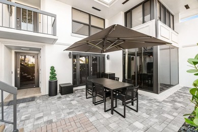 Unparalleled lake and golf course vistas set the stage for this on Quail Ridge Golf Course and Country Club in Florida - for sale on GolfHomes.com, golf home, golf lot