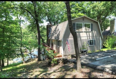Lakefront home in popular Port Duncan with boat dock.  This home on Shangri La Golf Resort and Club in Oklahoma - for sale on GolfHomes.com, golf home, golf lot