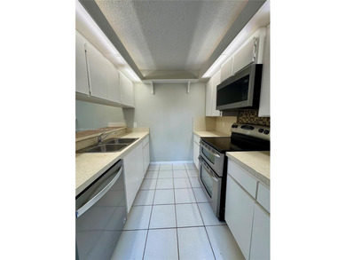 2 Bedroom 2.5 Baths plus additional Room (can be a 3rd Bedroom on Pine Island Ridge Country Club in Florida - for sale on GolfHomes.com, golf home, golf lot