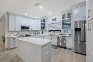 Welcome to luxury living in this stunning 4-bedroom, 3.5-bath on Redland Golf and Country Club in Florida - for sale on GolfHomes.com, golf home, golf lot