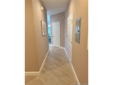 This exquisite first-floor condominium boasts unobstructed views on The Legacy Golf and Tennis Club in Florida - for sale on GolfHomes.com, golf home, golf lot