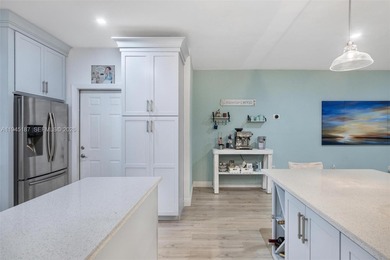 Welcome to luxury living in this stunning 4-bedroom, 3.5-bath on Redland Golf and Country Club in Florida - for sale on GolfHomes.com, golf home, golf lot