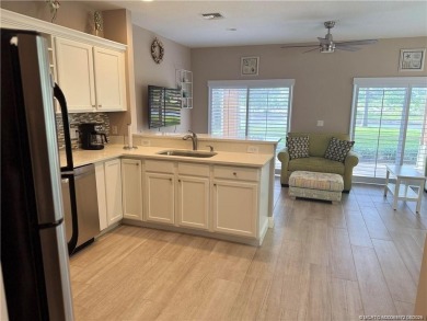 This exquisite first-floor condominium boasts unobstructed views on The Legacy Golf and Tennis Club in Florida - for sale on GolfHomes.com, golf home, golf lot