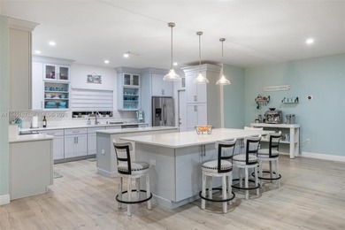 Welcome to luxury living in this stunning 4-bedroom, 3.5-bath on Redland Golf and Country Club in Florida - for sale on GolfHomes.com, golf home, golf lot