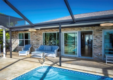 This furnished-remodeled Gulf Access home, nestled at the end of on Royal Tee Country Club in Florida - for sale on GolfHomes.com, golf home, golf lot