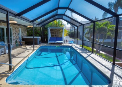 This furnished-remodeled Gulf Access home, nestled at the end of on Royal Tee Country Club in Florida - for sale on GolfHomes.com, golf home, golf lot