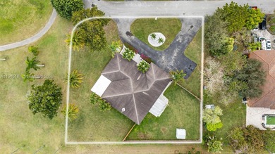 Welcome to luxury living in this stunning 4-bedroom, 3.5-bath on Redland Golf and Country Club in Florida - for sale on GolfHomes.com, golf home, golf lot