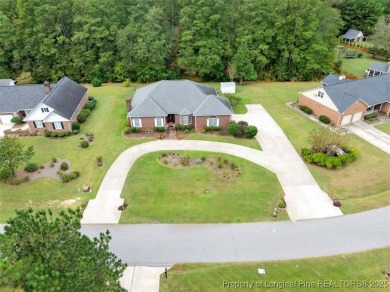 This beautifully maintained 3-bedroom, 3-bath all-brick home is on Baywood Golf Club in North Carolina - for sale on GolfHomes.com, golf home, golf lot