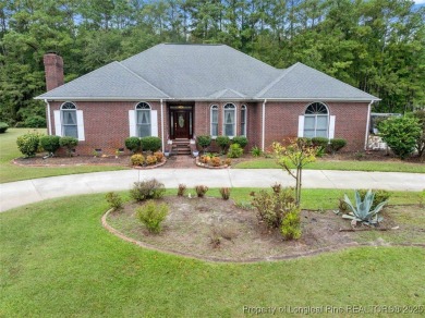 This beautifully maintained 3-bedroom, 3-bath all-brick home is on Baywood Golf Club in North Carolina - for sale on GolfHomes.com, golf home, golf lot
