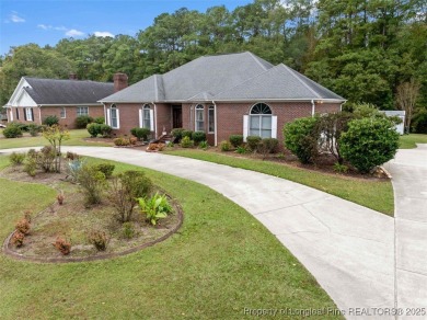 This beautifully maintained 3-bedroom, 3-bath all-brick home is on Baywood Golf Club in North Carolina - for sale on GolfHomes.com, golf home, golf lot