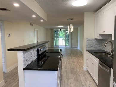 RARE FIND! COMPLETELY REMODELED! AMAZING VIEW TO GOLF COURSE AND on Jacaranda Golf Club in Florida - for sale on GolfHomes.com, golf home, golf lot