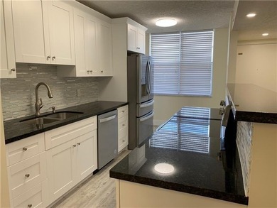 RARE FIND! COMPLETELY REMODELED! AMAZING VIEW TO GOLF COURSE AND on Jacaranda Golf Club in Florida - for sale on GolfHomes.com, golf home, golf lot