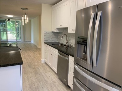 RARE FIND! COMPLETELY REMODELED! AMAZING VIEW TO GOLF COURSE AND on Jacaranda Golf Club in Florida - for sale on GolfHomes.com, golf home, golf lot