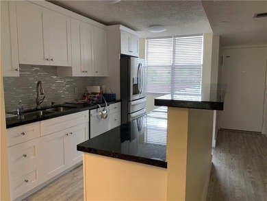 RARE FIND! COMPLETELY REMODELED! AMAZING VIEW TO GOLF COURSE AND on Jacaranda Golf Club in Florida - for sale on GolfHomes.com, golf home, golf lot