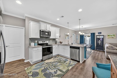 Welcome to this beautifully maintained 3-bedroom, 2-bath coastal on Crow Creek Golf Club in North Carolina - for sale on GolfHomes.com, golf home, golf lot