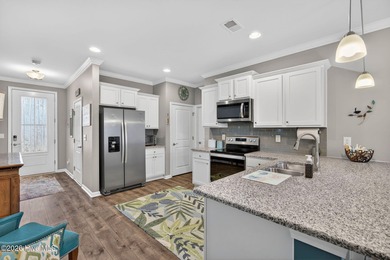 Welcome to this beautifully maintained 3-bedroom, 2-bath coastal on Crow Creek Golf Club in North Carolina - for sale on GolfHomes.com, golf home, golf lot