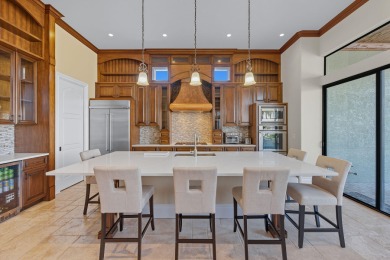 This stunning waterfront residence offers direct Gulf access on Island Country Club in Florida - for sale on GolfHomes.com, golf home, golf lot