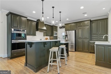 Experience the perfect blend of charm and elegance in this on Bridgemill Golf Club in Georgia - for sale on GolfHomes.com, golf home, golf lot