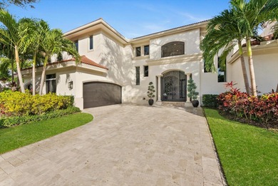 Located in Boca Grove, this two-story Mediterranean residence on Boca Grove Golf and Tennis in Florida - for sale on GolfHomes.com, golf home, golf lot