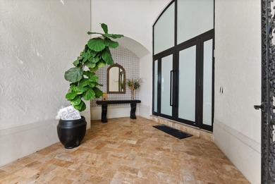 Located in Boca Grove, this two-story Mediterranean residence on Boca Grove Golf and Tennis in Florida - for sale on GolfHomes.com, golf home, golf lot