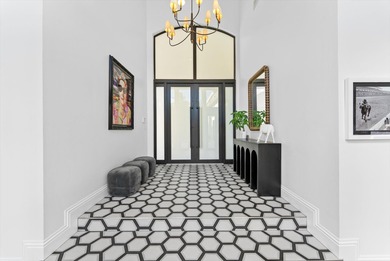 Located in Boca Grove, this two-story Mediterranean residence on Boca Grove Golf and Tennis in Florida - for sale on GolfHomes.com, golf home, golf lot