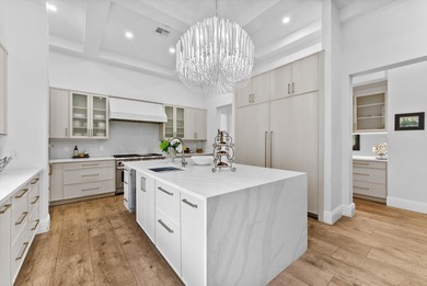 Located in Boca Grove, this two-story Mediterranean residence on Boca Grove Golf and Tennis in Florida - for sale on GolfHomes.com, golf home, golf lot