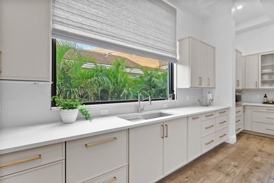 Located in Boca Grove, this two-story Mediterranean residence on Boca Grove Golf and Tennis in Florida - for sale on GolfHomes.com, golf home, golf lot