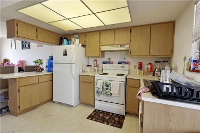 This income-producing duplex is located in San Carlos Park close on Estero Country Club in Florida - for sale on GolfHomes.com, golf home, golf lot