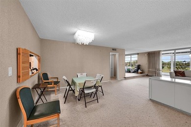 RARE CORNER KING MODEL IN PALM AIRE WITH GOLF VIEWS FROM EVERY on Palm-Aire Country Club and Resort - The Oaks in Florida - for sale on GolfHomes.com, golf home, golf lot