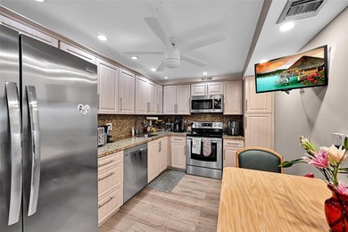 RARE CORNER KING MODEL IN PALM AIRE WITH GOLF VIEWS FROM EVERY on Palm-Aire Country Club and Resort - The Oaks in Florida - for sale on GolfHomes.com, golf home, golf lot