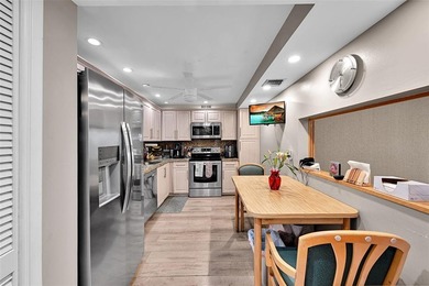 RARE CORNER KING MODEL IN PALM AIRE WITH GOLF VIEWS FROM EVERY on Palm-Aire Country Club and Resort - The Oaks in Florida - for sale on GolfHomes.com, golf home, golf lot