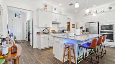 This is a SANDPIPER VILLA featuring large open concept kitchen on Mystic Dunes Resort and Golf Club in Florida - for sale on GolfHomes.com, golf home, golf lot